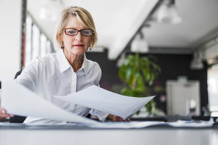 Lady sorting paperwork