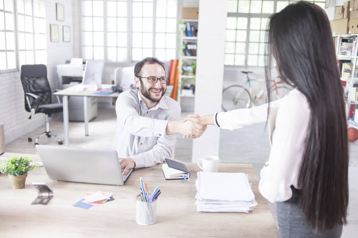 man and woman shaking hands